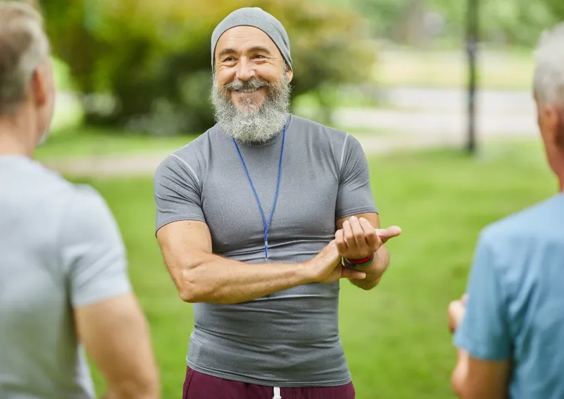aged trainer checking heart beat utc