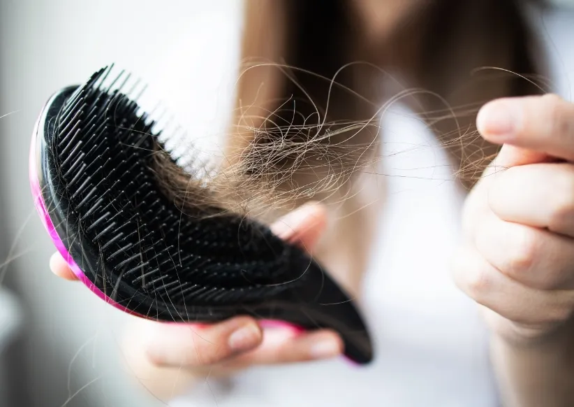 close up focus on the arm with combs and hair utc