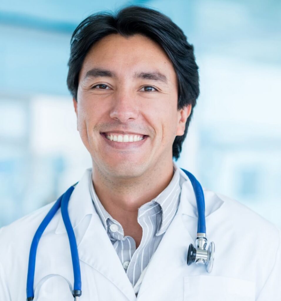 portrait of a male doctor smiling at the hospital utc jpg